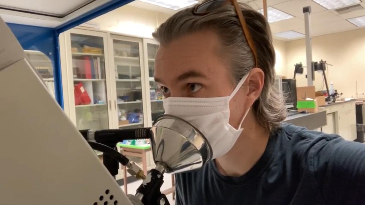 A UC Davis researcher tests a face covering in the lab. uc davis chemical engineering face covering study covid william ristenpart