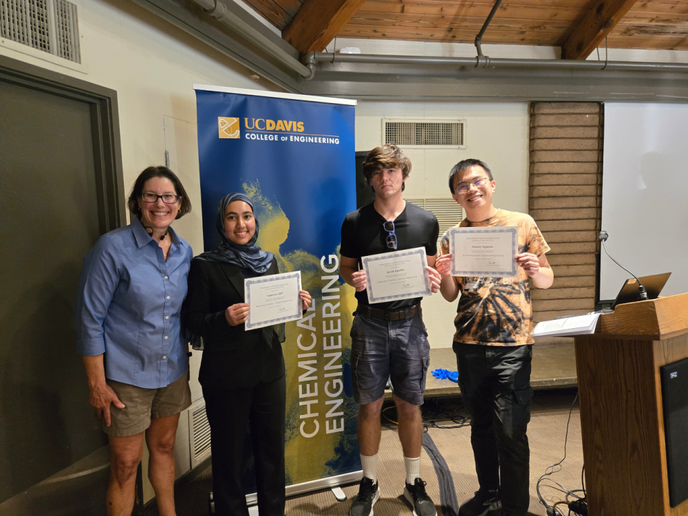 Department Chair Dr. Kuhl presents the Chemical and Biochemical Engineering Awards to Tasneem Afiff, Jacob Aquilio, and Danny Nguyen